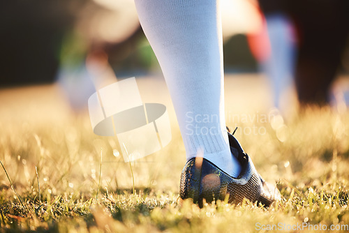 Image of Sports, training and foot of person on field ready for game, competition and tournament outdoors. Fitness, mockup and closeup of shoes of player on grass for exercise, match and workout in practice