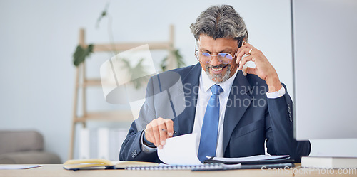 Image of Business man, reading documents and phone call for contract negotiation, legal advice and compliance at desk. Corporate lawyer, smartphone and data analysis with paperwork, notes and smile in office