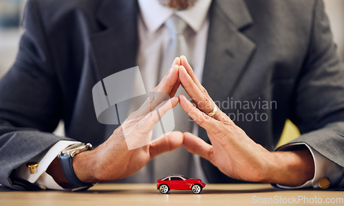 Image of Desk, hands and a person covering for car insurance, investment and auto support. Table, corporate and a businessman with security or safety of transportation for a guarantee or premium service