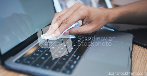 Image of Cleaning, wipe dust and hands with laptop for hygiene, disinfection and maintenance for health in office. Technology, closeup and keyboard for bacteria, dust and dirt on computer for clean workplace