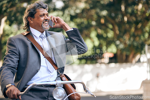 Image of Business man, bike and phone call in city, park and outdoor road for networking, thinking and negotiation. Mature entrepreneur, bicycle and smartphone with chat, ideas or smile on eco friendly travel