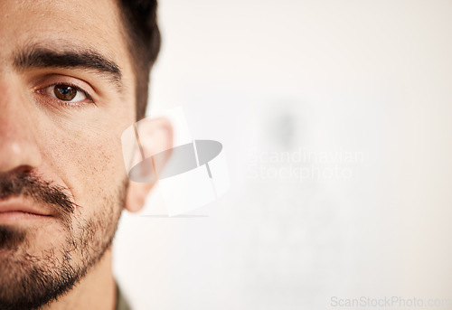 Image of Closeup, eye exam of man and face with mockup space for contact lenses, healthcare and blur vision at optometrist consultation. Half portrait, serious person and medical assessment or wellness test