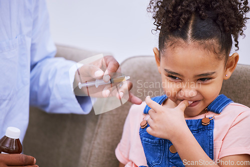 Image of Sick, syringe and disgust with child and medicine for consulting, helping and illness. Medical, healthcare and cough syrup with young girl and parent in family home for wellness, care and supplements
