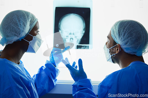 Image of Head xray, doctors and medical discussion for planning test results, charts and advice for expert analysis. Radiology, neurology and surgeon team check skull x ray, anatomy and review mri for surgery