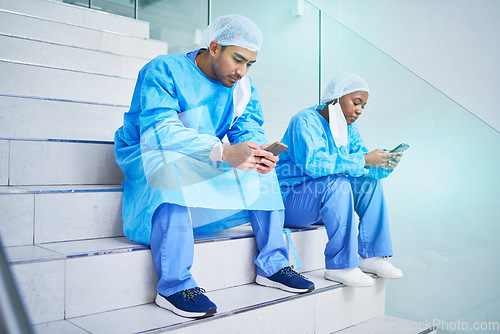 Image of Surgeon team, stairs and phone in hospital for telehealth, healthcare or online wellness. Smartphone, doctor and people on steps on internet, reading email and medical professional research in clinic