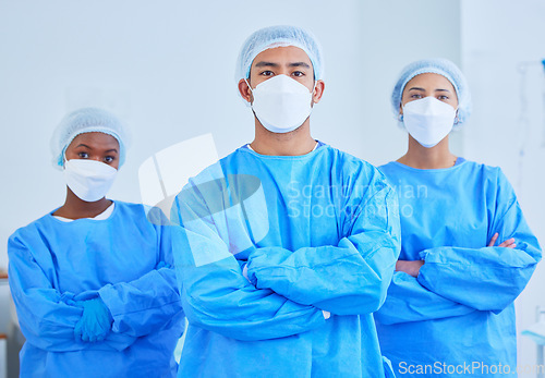 Image of Face mask, surgeon team and people with arms crossed in hospital, healthcare and wellness. Portrait, doctor and medical professional group, expert nurse and confident surgery employee in ppe scrubs