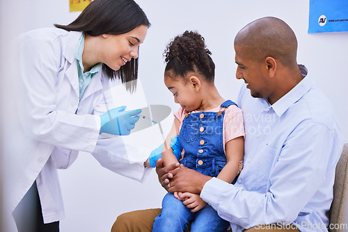 Image of Kid, dad and woman doctor with syringe for vaccine, flu shot or medicine injection in clinic or hospital. Father, girl and pediatrician in office with needle, vaccination and child care consultation