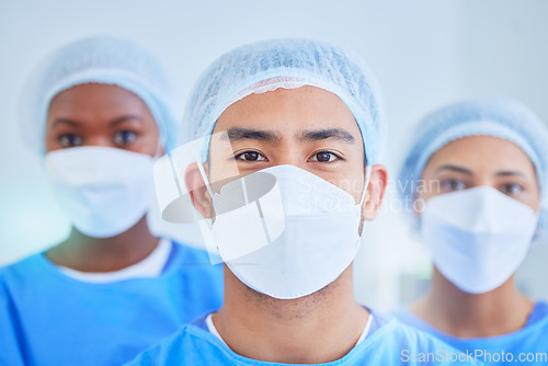 Image of Surgeon group, face mask and people in hospital, healthcare and wellness expert in clinic. Portrait, doctor and medical professional team, nurse worker and confident surgery employee in ppe scrubs