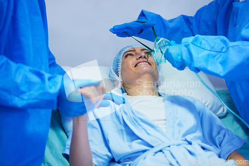 Image of Surgery, anesthesia and woman with oxygen mask for medical service, operation and procedure. Healthcare, hospital and surgeons with gas, breathing and ventilation equipment for patient in theater