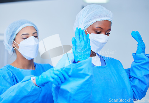 Image of Doctor, theatre clothes and medical expert for surgery, operation, emergency and healthcare in hospital. Surgeon, women and professional nurse in teamwork and support for health, work and medicine