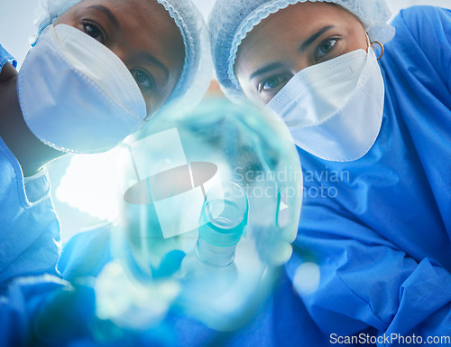 Image of Surgery, anesthesia and doctors with oxygen mask for medical service, operation and procedure. Healthcare, hospital and portrait of surgeons with gas, breathing and ventilation equipment for patient