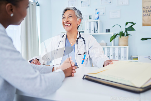 Image of Happy doctor, patient and talking at consultation in hospital with a woman for medical advice. Health care worker and person for conversation, results and communication for wellness and health