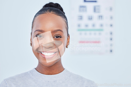 Image of Face, black woman smile and ophthalmology patient in hospital for vision, healthcare or wellness. Portrait, optometrist and happy person in clinic with eye chart for medical professional optician