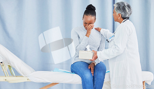 Image of Doctor, patient and sad talk about hospital results of a black woman with tissue, support and cancer. Health care worker and sick person with bad news or conversation or crying with help and empathy