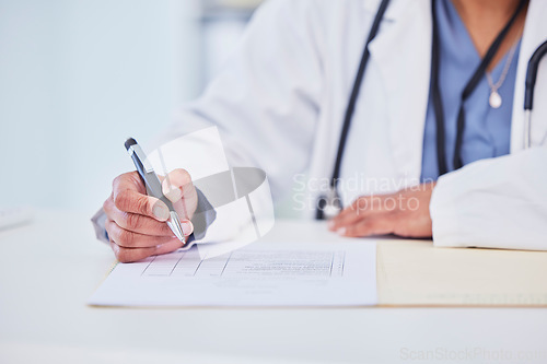 Image of Doctor, hands and writing, health insurance paperwork and compliance with trust, help and healthcare at hospital. Test results, medical report and person with info on document, policy and closeup