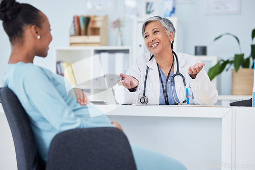 Image of Doctor, pregnant patient and consultation, women in hospital office and communication with gynecology. Talking, maternal healthcare and pregnancy, medical advice and fertility with help and trust