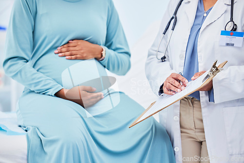 Image of Doctor, woman hands and pregnancy in a hospital with mama, stomach and baby care. Wellness, abdomen and pregnant healthcare with nurse and medical chart of a clinic check for health of a mother