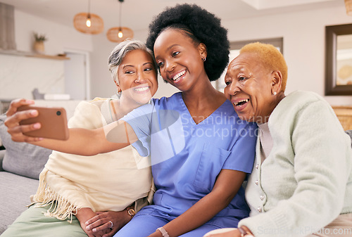 Image of Selfie, caregiver and senior women on sofa smile for social media, online post and profile picture together. Retirement, nursing home and nurse with elderly people take photo on smartphone for memory