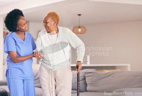 Image of Nurse, holding hands and senior black woman with walking stick, help or smile in home. Caregiver, support and elderly patient with a disability, cane and kindness in assistance, empathy or healthcare