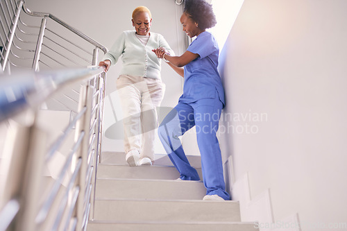 Image of Steps, nurse and help elderly woman, holding hands and assistance in home. Caregiver, stairs and senior African patient walking down, support of person with a disability and kindness in healthcare