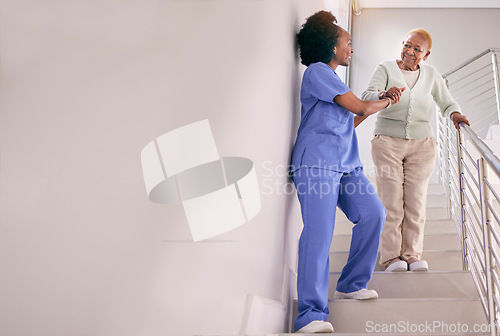 Image of Nurse, stairs and help senior woman, holding hands and assistance in home. Caregiver, steps and elderly African patient walking down, support of person with a disability and happiness in healthcare