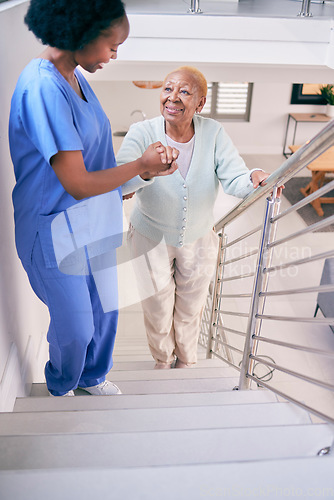 Image of Caregiver, stairs and elderly woman holding hands, help and assistance in home. Nurse, steps and senior African patient walking up, support of person with a disability and happiness in healthcare