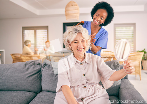 Image of Nurse brush hair of happy mature woman in the living room of the modern retirement home for self care. Mirror, routine and African female nurse doing a hairstyle for an elderly patient in the lounge.