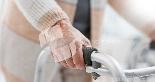 Image of Hands, walker and an old person with a disability in recover or rehabilitation in a clinic for mobility and stability. Healthcare, medical and physiotherapy with a senior patient in a nursing home