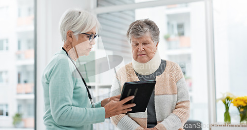 Image of Results, tablet and senior woman with doctor talking about x ray, data or report on healthcare, injury or elderly care consultation. Patient, nurse and advice in meeting with medical worker or expert