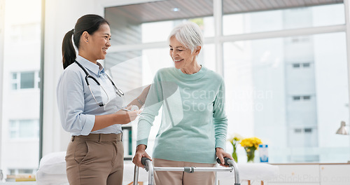 Image of Rehabilitation, walker or doctor walking with old woman in retirement or hospital for wellness or support. Physio, nurse helping or elderly patient learning with frame in physical therapy recovery