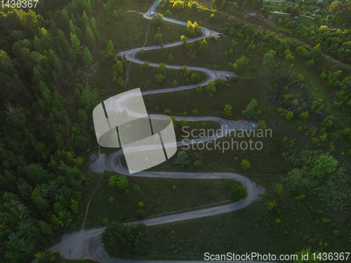 Image of Aerial top vew of winding road in the city