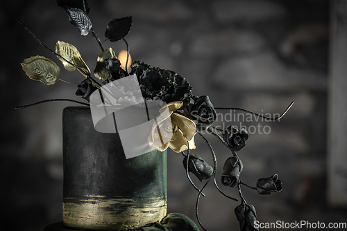 Image of Dark green toned wedding cake flower decor