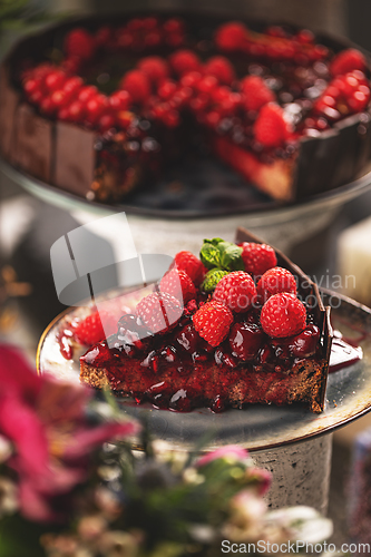 Image of Slice of chocolate cake with cherry sauce