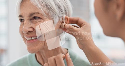 Image of Old woman, doctor hands and patient with hearing aid, help and support with healthcare in clinic. Person with disability, deaf and people, trust and communication, health insurance and medical