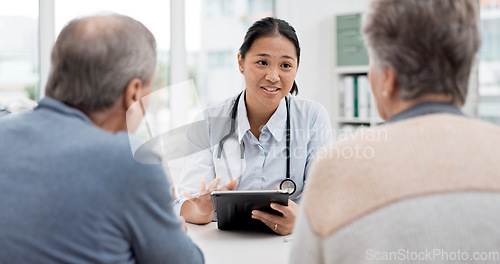 Image of Medical consultation, tablet and senior couple, doctor and talk to client, explain hospital service or healthcare insurance. Discussion, good results or happy cardiology worker consulting old people
