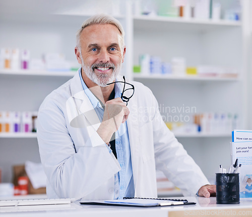 Image of Pharmacy, consulting and smile with portrait of man for medical, pills and helping. Medicine, healthcare and manager with mature pharmacist in dispensary store for retail, supplements or prescription