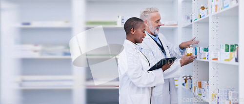 Image of Discussion, tablet and pharmacists checking medication for inventory, stock or medical research. Healthcare, medicine and senior chemist mentor teaching female pharmaceutical student with technology.