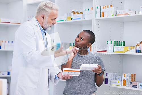 Image of Pharmacist, product choice and woman question healthcare worker on pills, medication or pharmaceutical. Pharmacy clinic, supplements and black person ask doctor recommendation on medicine decision