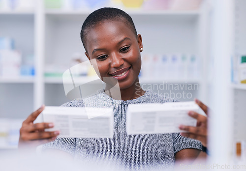 Image of Pharmacy, product choice and happy black woman, customer or client reading package, box or pharmaceutical label. Hospital clinic store, supplements pills or African person smile for medicine decision
