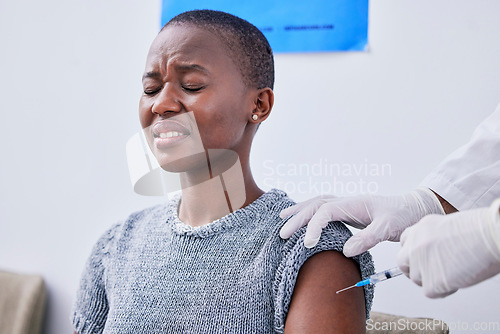 Image of Vaccine, injection and black woman with fear in clinic for virus protection, vaccination and flu shot. Healthcare, phobia and patient with pain from needle for medicine, treatment and antibiotic