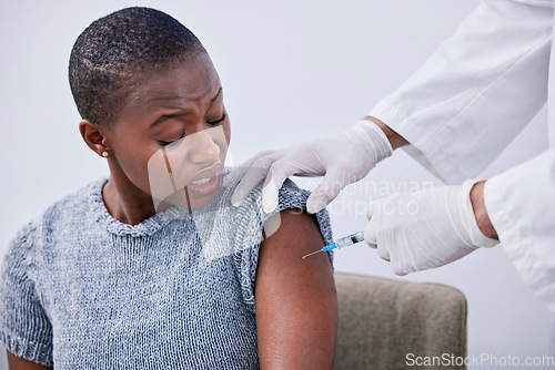 Image of Flu shot, black woman or patient with vaccine, needle or healthcare with treatment, cure or hands. Arm, person or lady with doctor, injection or medication with vaccination, consultation or syringe