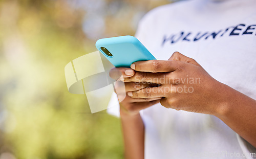 Image of Person hands, phone and volunteering in nature with social media FAQ, blog or community service networking. Volunteer on mobile or chat for earth day communication, NGO or nonprofit contact in park