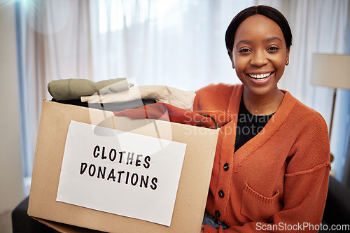 Image of Clothes donation, charity and woman portrait with box for nonprofit and cardboard container at home. African female person, donating and house with giveaway for community support with packing