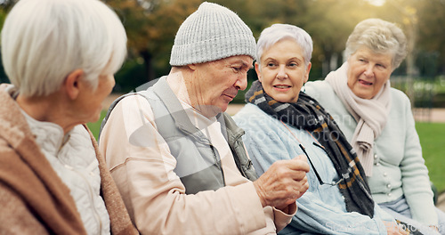 Image of Friends, talking and senior people in park for bonding, conversation and quality time together outdoors. Friendship, happy and elderly man and women in retirement on bench for relaxing in nature