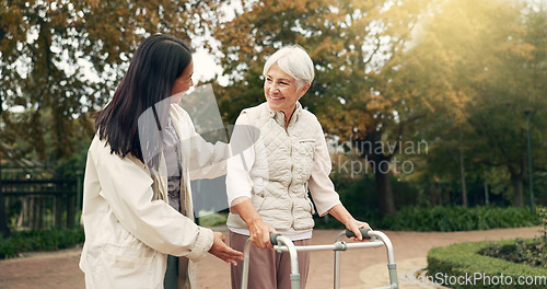 Image of Park, walker and woman help senior walking as support, trust and care for morning healthcare exercise or workout. Health, physical therapy and elderly with caregiver for outdoor rehabilitation