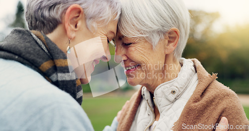 Image of Love, connection and senior women being affection for romance and bonding on an outdoor date. Nature, commitment and elderly female couple in retirement with intimate moment in a green garden or park