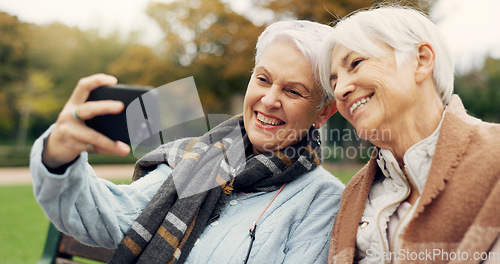 Image of Senior, women and selfie in a park happy, bond and relax in nature on a bench together. Friends, old people and ladies smile for social media, profile picture or memory in forest chilling on weekend