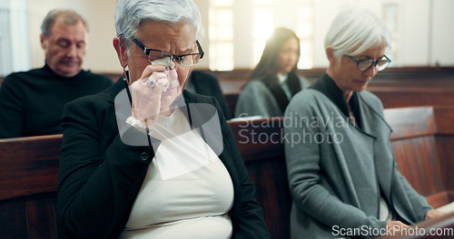 Image of Sad, funeral or old woman crying in church for God, holy spirit or religion in cathedral or Christian community. Tissue, depressed or upset elderly person in chapel or sanctuary for Jesus Christ