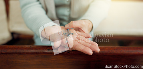 Image of Rosary, prayer or hands of woman in church for God, holy spirit or religion with faith in Christian cathedral. Jewelry closeup, spiritual lady or person in chapel praying to praise Jesus Christ alone