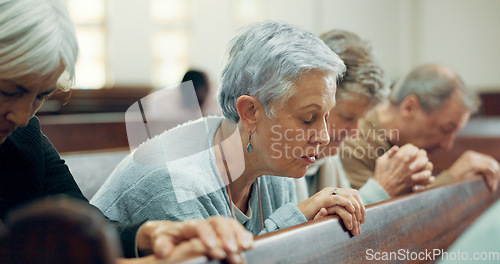 Image of Elderly, prayer or old woman in church for God, holy spirit or religion in cathedral or Christian community. Faith, spiritual lady or senior person in chapel or sanctuary to praise Jesus Christ